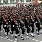 A picture of hundreds of IRGC members marching in ceremonial uniform in Tehran.